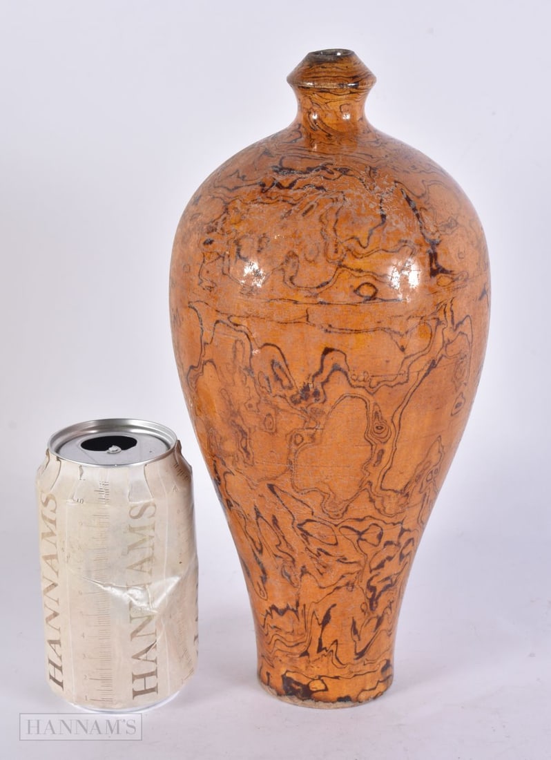 A CHINESE MARBLEISED POTTERY VASE. 28 cm high. (1 of 4)