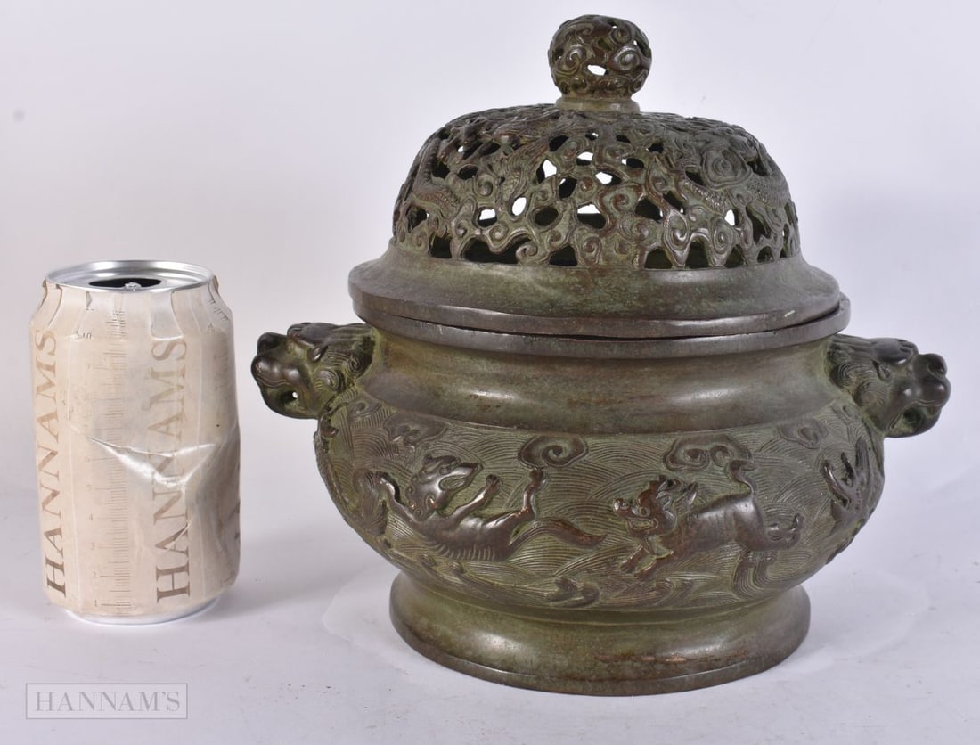 A CHINESE BRONZE CENSER with reticulated cover. 22 cm x 17 cm.: A CHINESE BRONZE CENSER with reticulated cover. 22 cm x 17 cm.