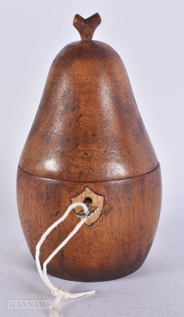 A TREEN WOOD FRUIT TEA CADDY. 18 cm high. (1 of 4)