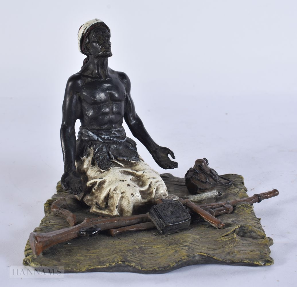 A COLD PAINTED BRONZE HUNTER. 15 cm x 12 cm.: A COLD PAINTED BRONZE HUNTER. 15 cm x 12 cm.