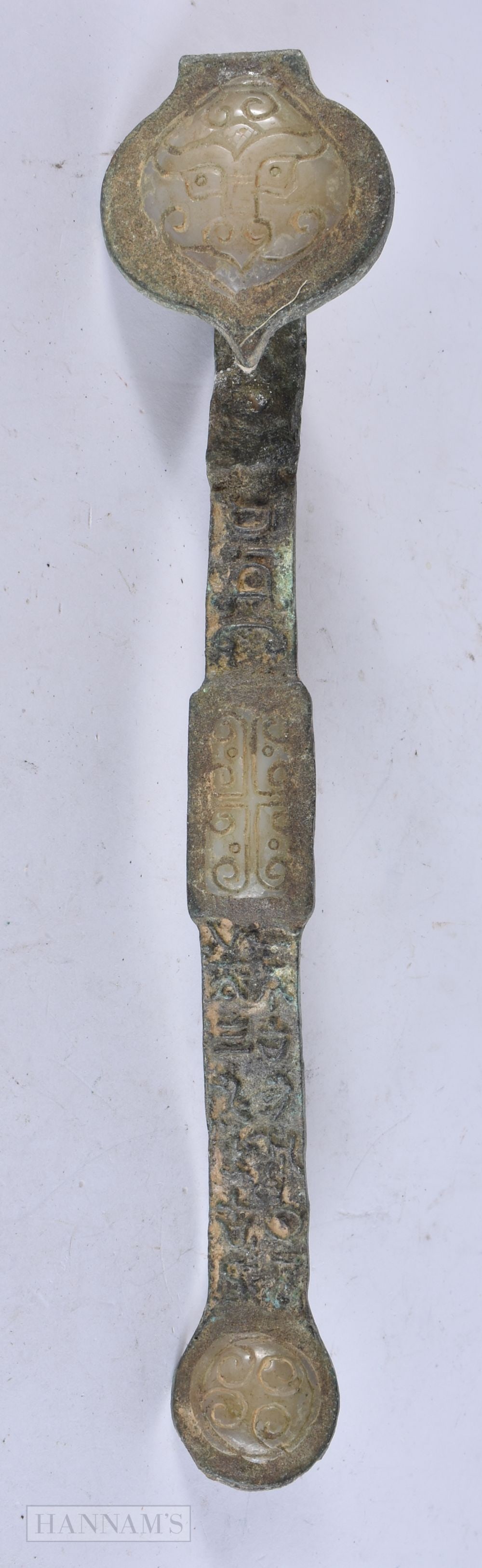 A CHINESE JADE INSET BRONZE RUI SCEPTRE. 33 cm wide.: A CHINESE JADE INSET BRONZE RUI SCEPTRE. 33 cm wide.