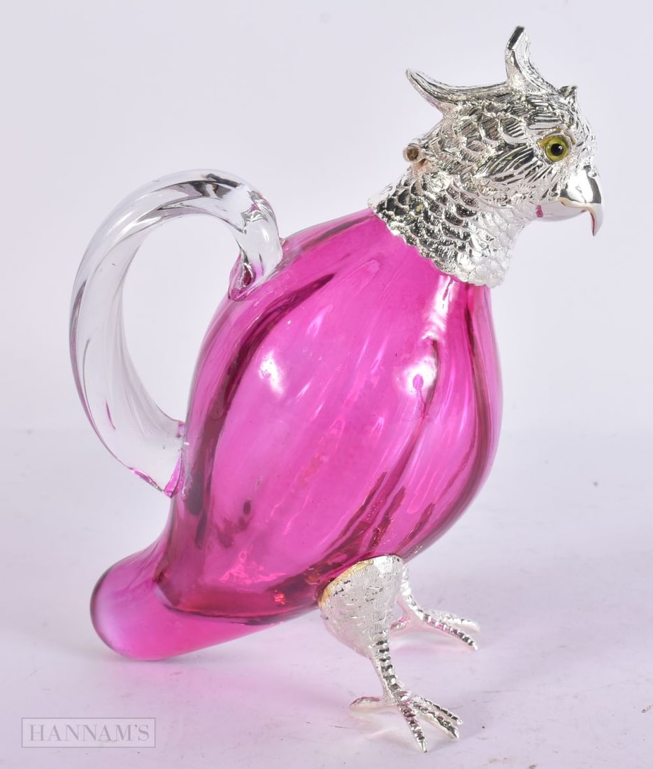 A SILVER PLATED BIRD CLARET JUG. 15 cm x 10 cm. (1 of 6)