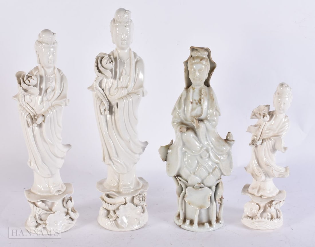 A 19TH CENTURY CHINESE BLANC DE CHINE PORCELAIN FIGURES together with three others. Largest 25 cm hi (1 of 5)