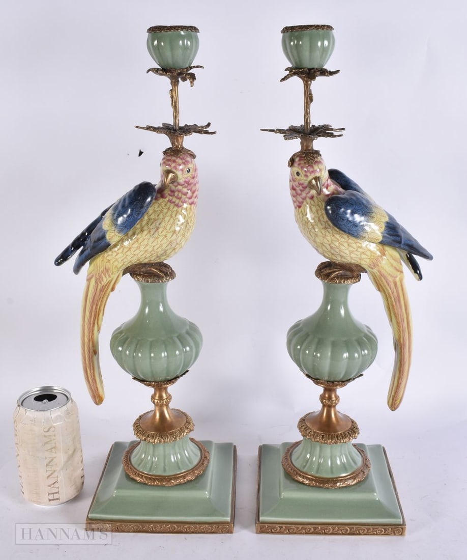 A PAIR OF PARROT POTTERY BRONZE CANDLESTICKS. 47 cm high. (1 of 6)