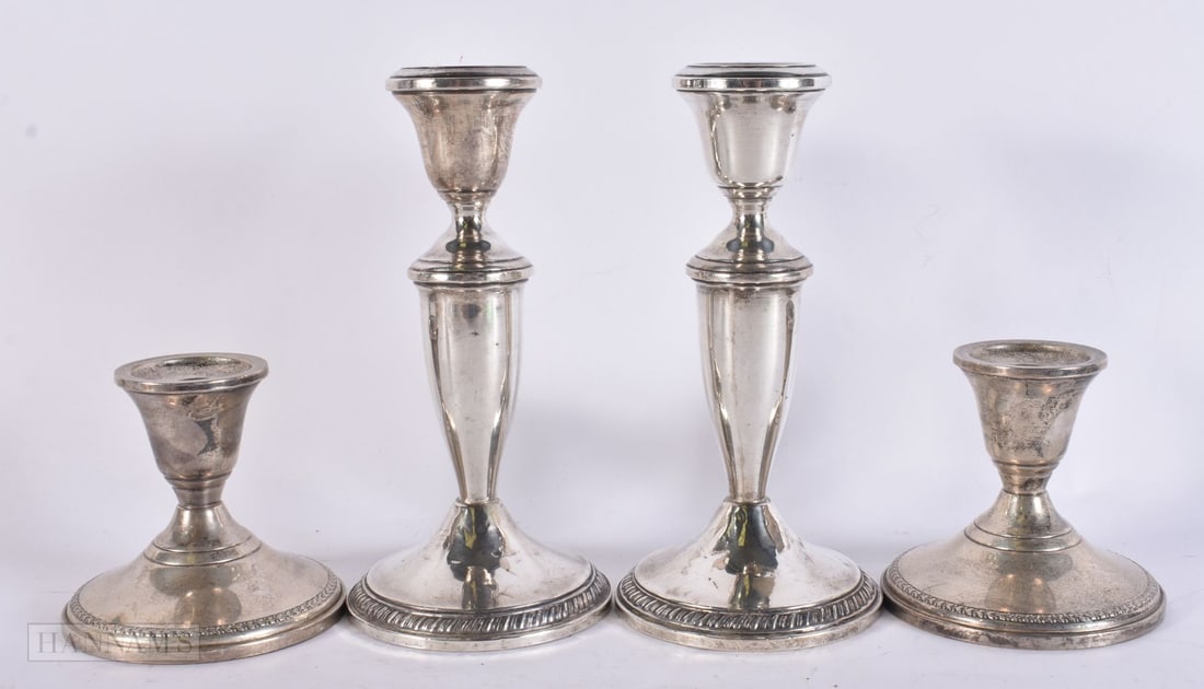 FOUR PAIRS OF SILVER CANDLESTICKS. 1140 grams overall. Largest 15 cm high. (4) (1 of 8)