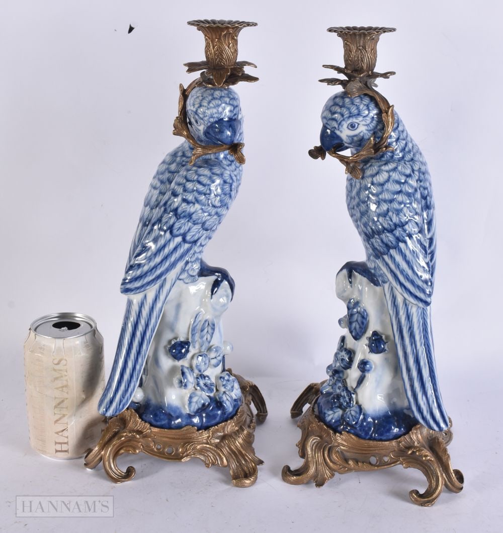A PAIR OF PARROT POTTERY BRONZE CANDLESTICKS. 36 cm high. (1 of 6)