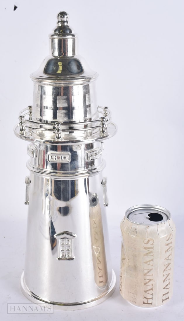 A SILVER PLATED LIGHTHOUSE COCKTAIL SHAKER. 34 cm high. (1 of 5)