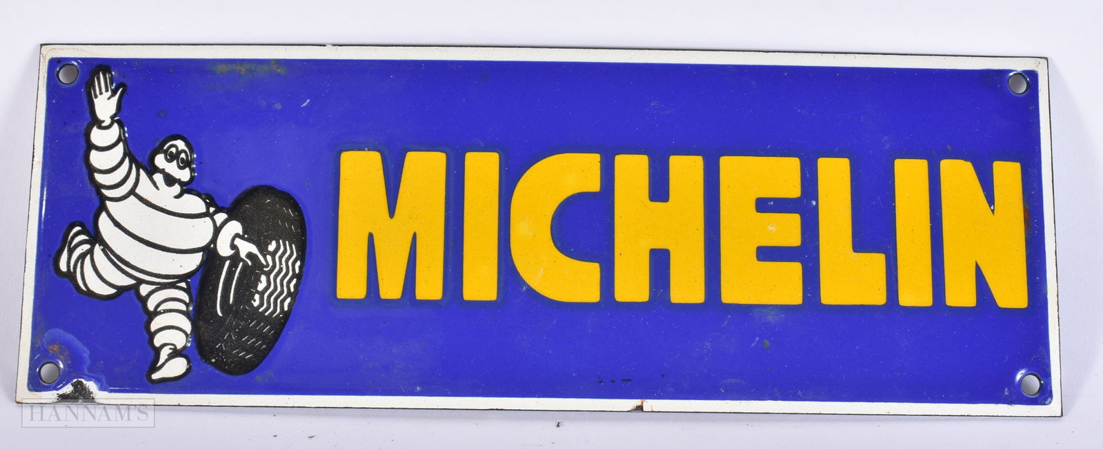 AN ENAMEL MICHELIN MAN SIGN. 30 cm x 12 cm. (1 of 2)