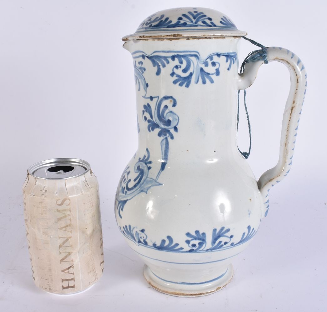 AN 18TH CENTURY DELFT FAIENCE TIN GLAZED JUG AND COVER. 25.5 cm high. (1 of 6)