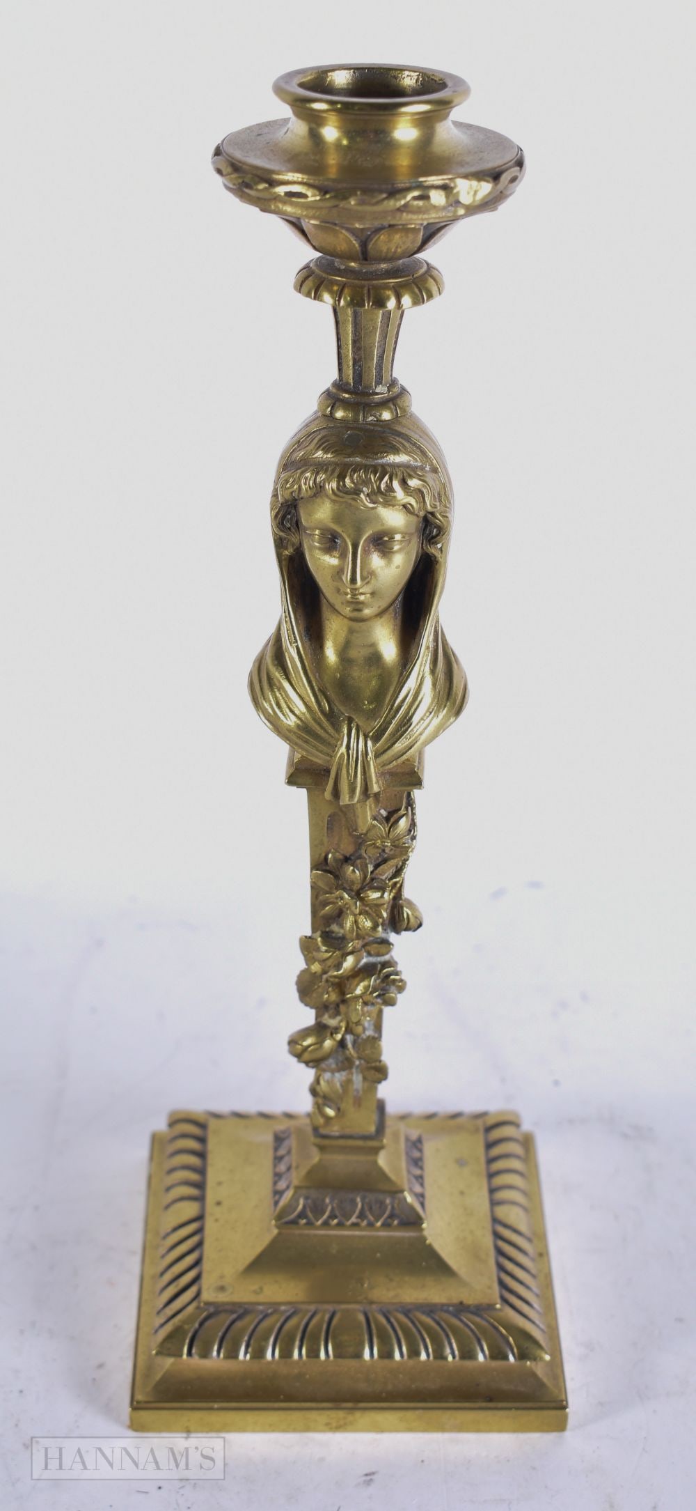 A FINE 19TH CENTURY FRENCH GILT BRONZE PORTRAIT CANDLESTICK beautifully cast with a female amongst t: A FINE 19TH CENTURY FRENCH GILT BRONZE PORTRAIT CANDLESTICK beautifully cast with a female amongst trailing flowers. 26.5 cm high.