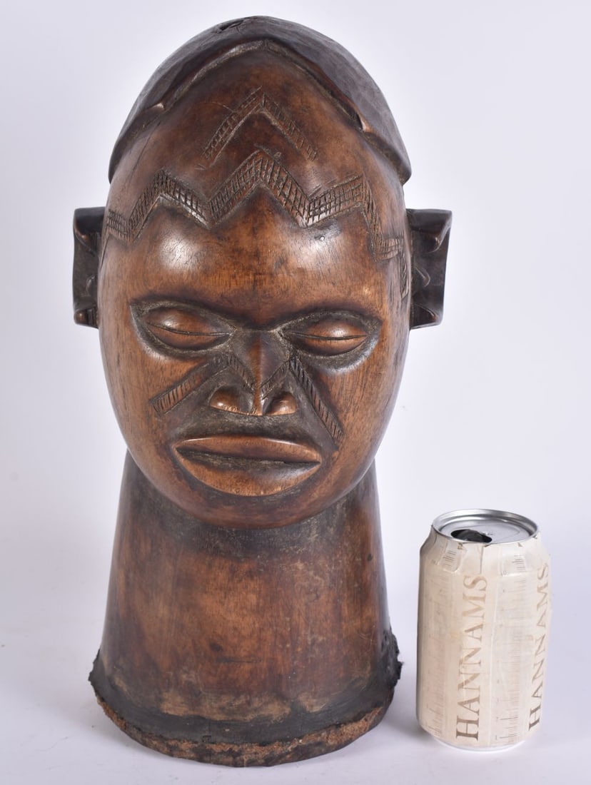 AN AFRICAN TRIBAL CARVED WOOD BUST OF A MALE. 38 cm x 13 cm. (1 of 7)