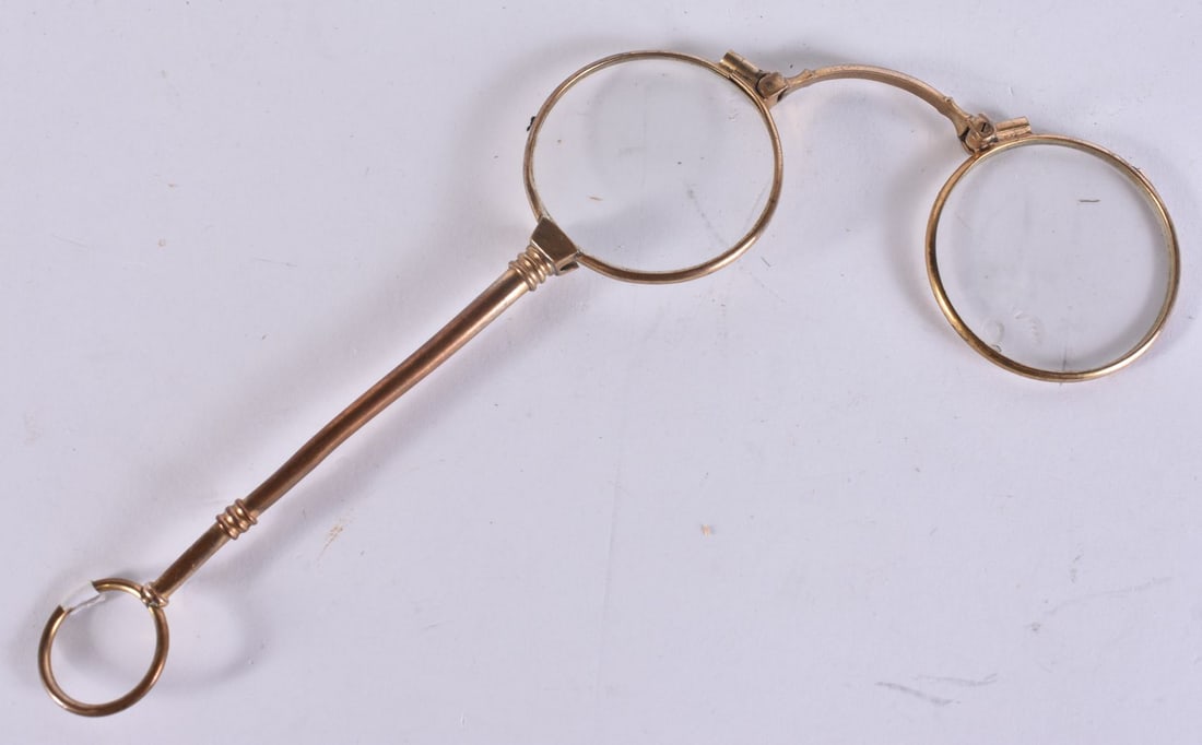 A PAIR OF YELLOW METAL LORGNETTES. 13 cm x 10 cm. (1 of 2)