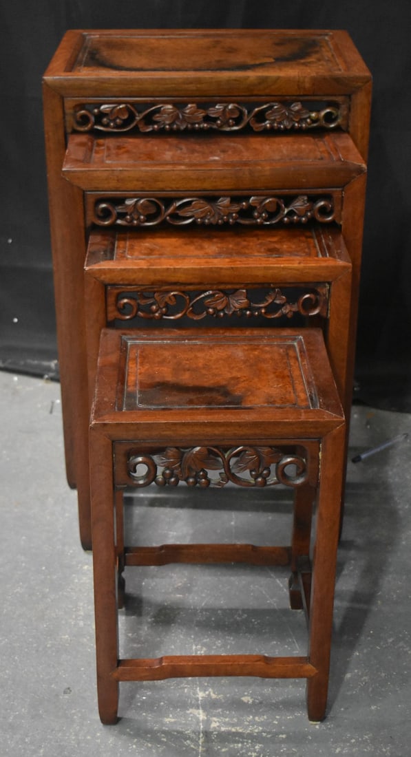 A LOVELY SET OF 19TH CENTURY CHINESE CARVED HUANGHUALI AND BURL WOOD NEST OF TABLES. Largest 66 cm x: A LOVELY SET OF 19TH CENTURY CHINESE CARVED HUANGHUALI AND BURL WOOD NEST OF TABLES. Largest 66 cm x 45.5 cm x 34.5 cm