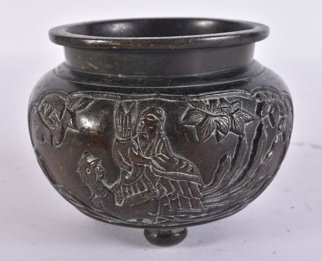 A CHINESE QING DYNASTY BRONZE CENSER decorated with scholars and landscapes. 9.5 cm wide.: A CHINESE QING DYNASTY BRONZE CENSER decorated with scholars and landscapes. 9.5 cm wide.