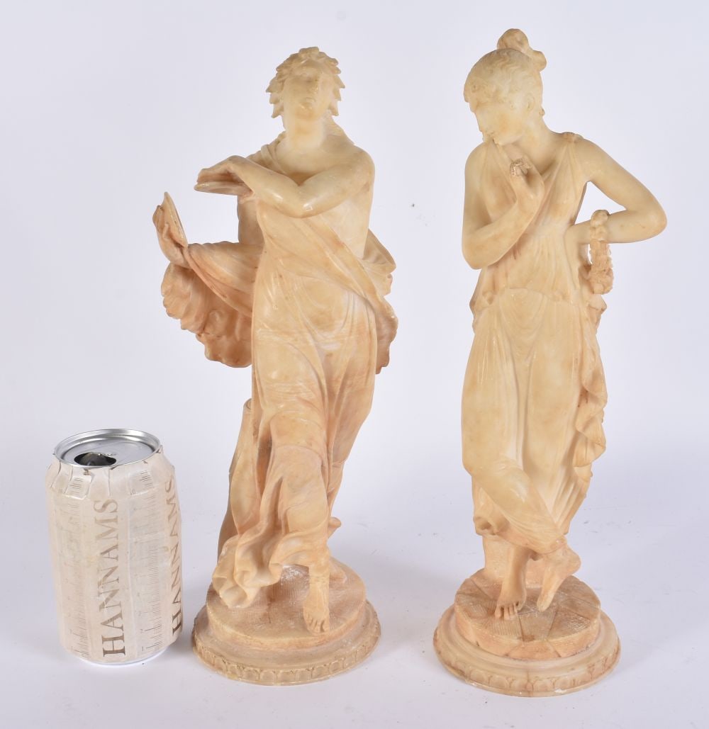 A PAIR OF 19TH CENTURY EUROPEAN GRAND TOUR CARVED ALABASTER FIGURES modelled upon circular stepped b: A PAIR OF 19TH CENTURY EUROPEAN GRAND TOUR CARVED ALABASTER FIGURES modelled upon circular stepped bases. 33 cm high.