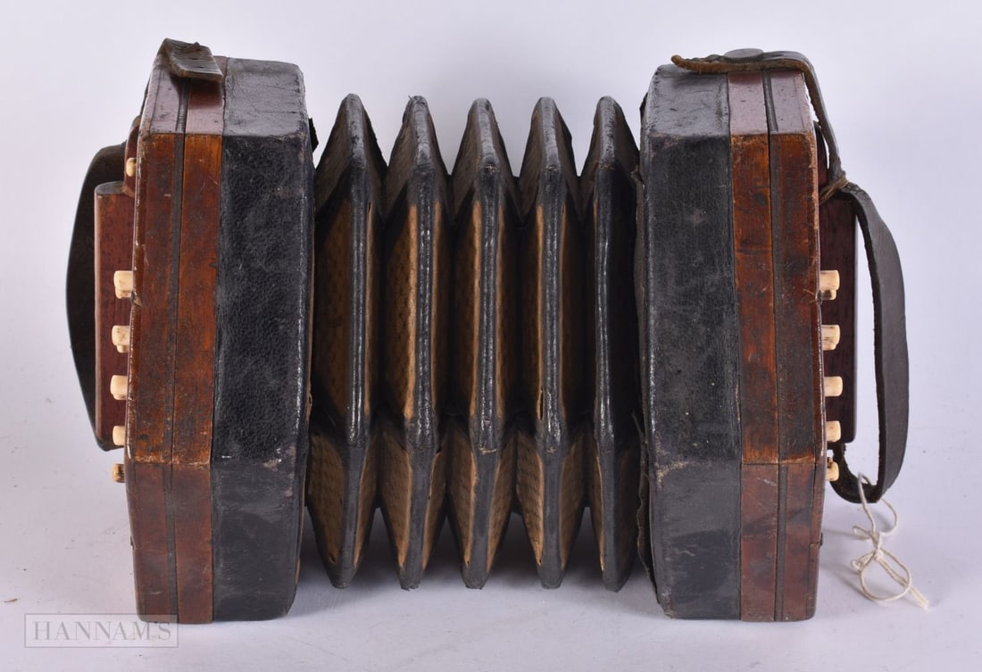 AN ANTIQUE CONCERTINA. 15 cm x 15 cm. (1 of 3)