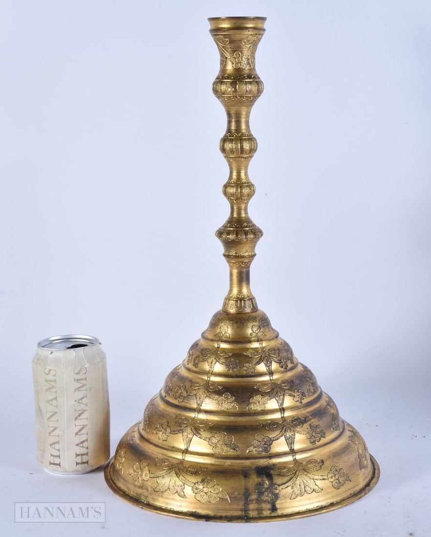 A LARGE TURKISH TOMBAK CANDLESTICK engraved with flowers and vines. 38 cm x 20 cm. (1 of 4)