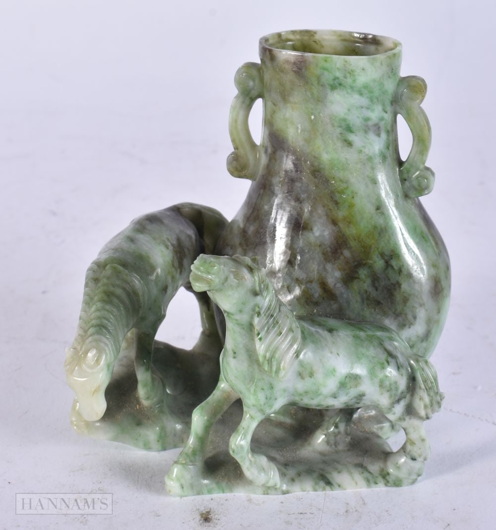 A LATE 19TH CENTURY CHINESE CARVED JADEITE SCHOLARS VASE Late Qing, formed with horses. 12 cm x 7 cm: A LATE 19TH CENTURY CHINESE CARVED JADEITE SCHOLARS VASE Late Qing, formed with horses. 12 cm x 7 cm.