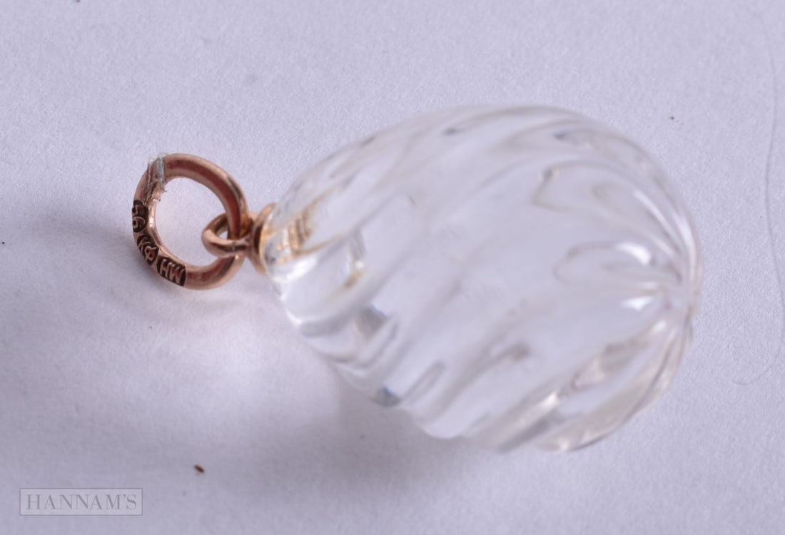 A 14CT GOLD ROCK CRYSTAL EGG PENDANT. 6.8 grams. 2.25 cm x 1.5 cm.: A 14CT GOLD ROCK CRYSTAL EGG PENDANT. 6.8 grams. 2.25 cm x 1.5 cm.
