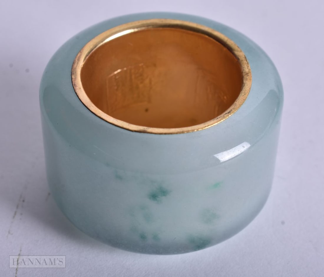 A CHINESE YELLOW METAL JADE ARCHERS RING. 36 grams. Z. (1 of 3)