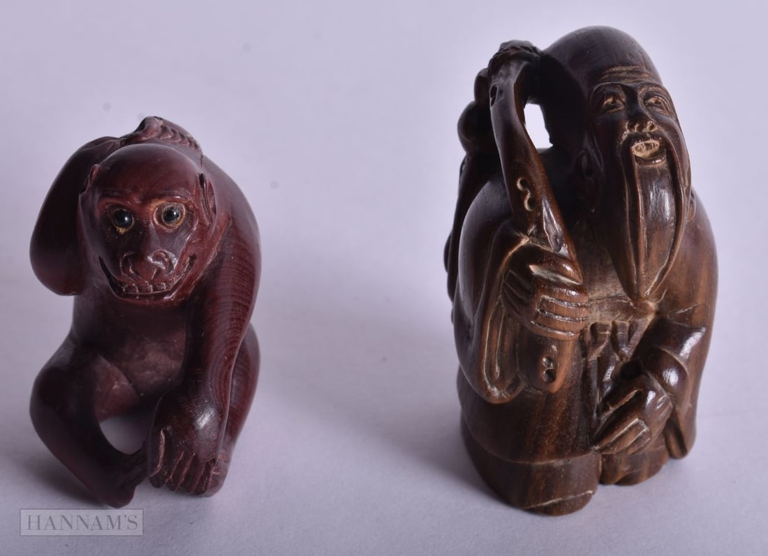 TWO JAPANESE CARVED WOOD NETSUKE. 4.25 cm x 3.25 cm. (2) (1 of 4)