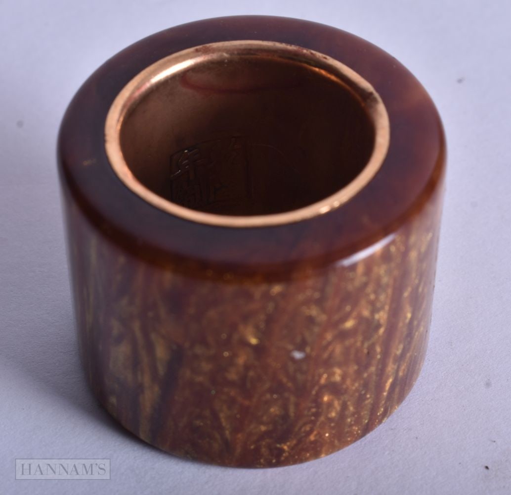 A CHINESE YELLOW METAL ARCHERS RING. 20 grams. T.: A CHINESE YELLOW METAL ARCHERS RING. 20 grams. T.
