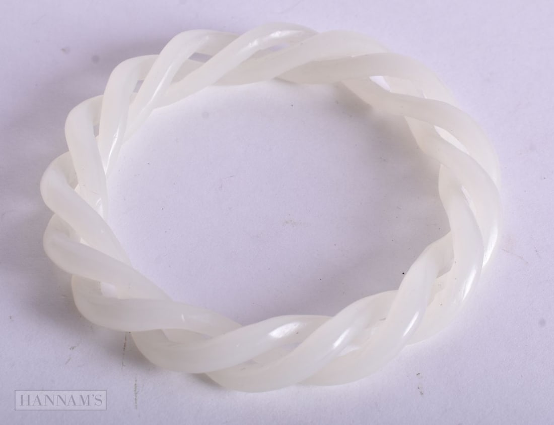 A CHINESE JADE BANGLE. 6.5 cm internal diameter. (1 of 2)