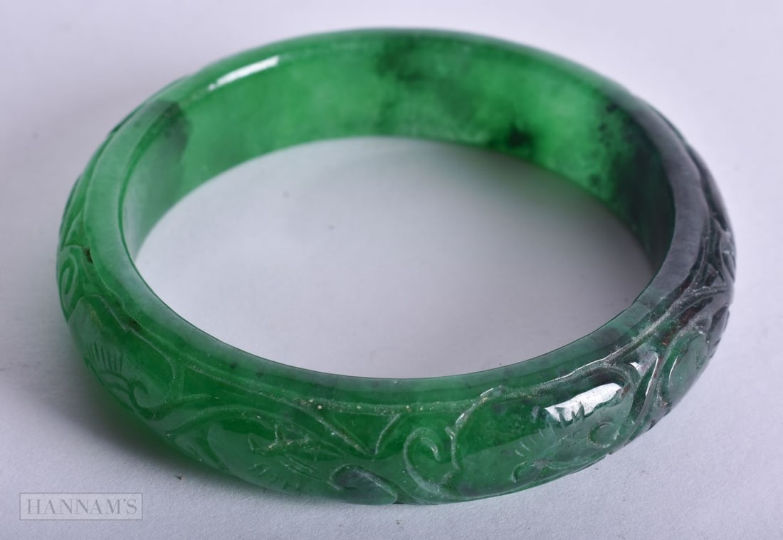 A CHINESE JADE BANGLE. 5.75 cm internal diameter. (1 of 3)