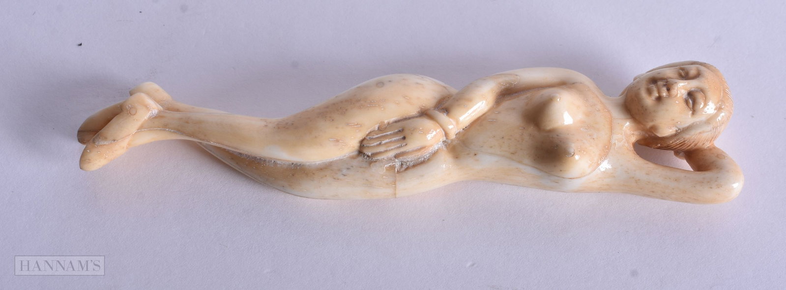 A CHINESE BONE DOCTORS FIGURE. 12.75 cm long.: A CHINESE BONE DOCTORS FIGURE. 12.75 cm long.