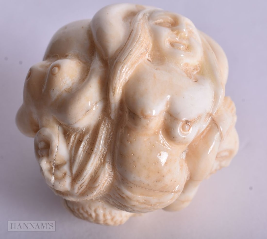 A CHINESE EROTIC BONE BALL. 3.75 cm wide.: A CHINESE EROTIC BONE BALL. 3.75 cm wide.