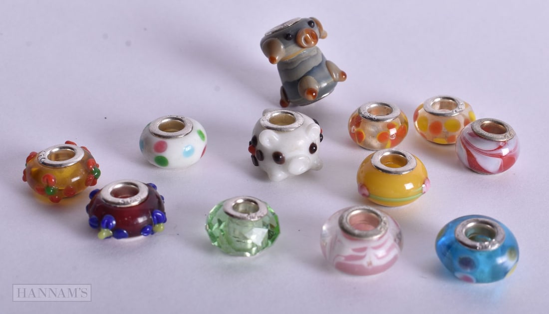 TWELVE SILVER CHARMS. 1.75 cm wide. (12) (1 of 2)