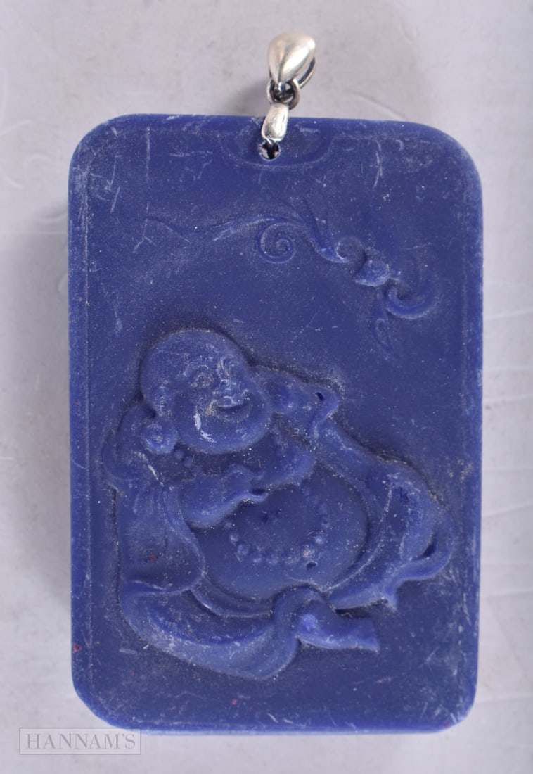 A CHINESE SILVER MOUNTED PENDANT. 5.25 cm wide.: A CHINESE SILVER MOUNTED PENDANT. 5.25 cm wide.