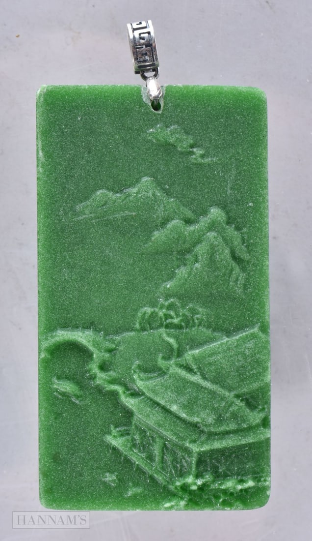 A CHINESE SILVER MOUNTED PENDANT. 6.5 cm x 3.5 cm.: A CHINESE SILVER MOUNTED PENDANT. 6.5 cm x 3.5 cm.