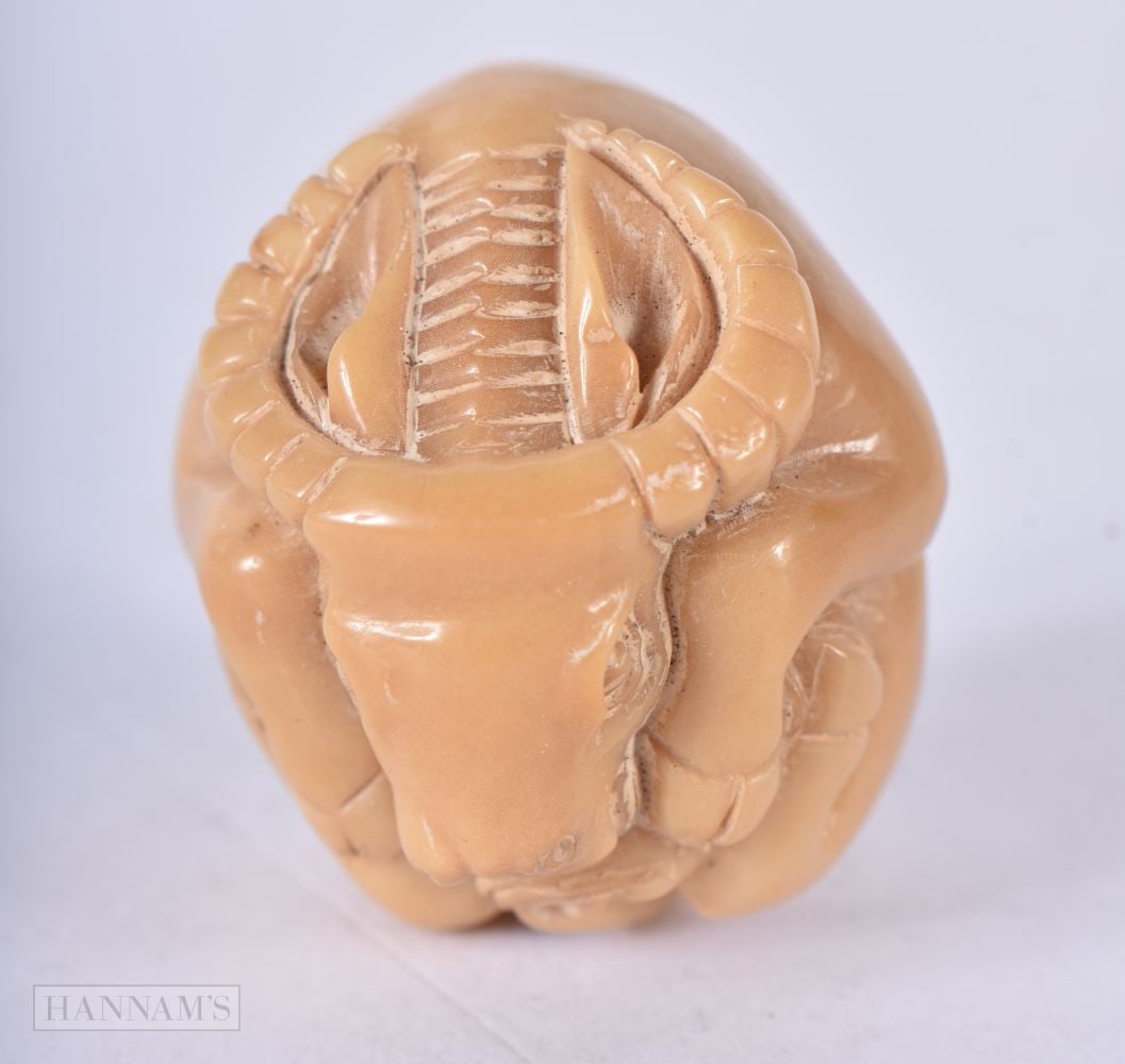 A JAPANESE TAG NUT RAM. 3 cm wide. (1 of 4)