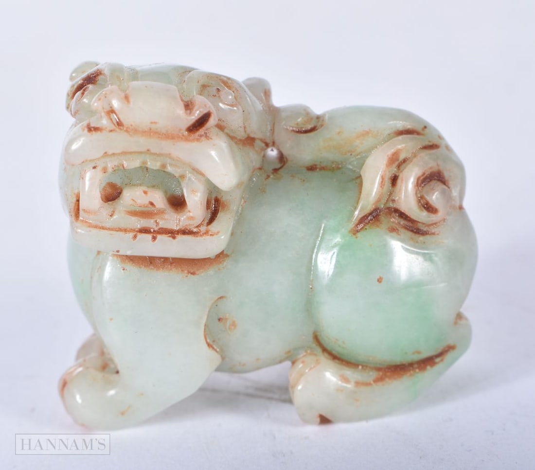 A CHINESE JADE FOO DOG. 4 cm x 4.5 cm. (1 of 4)