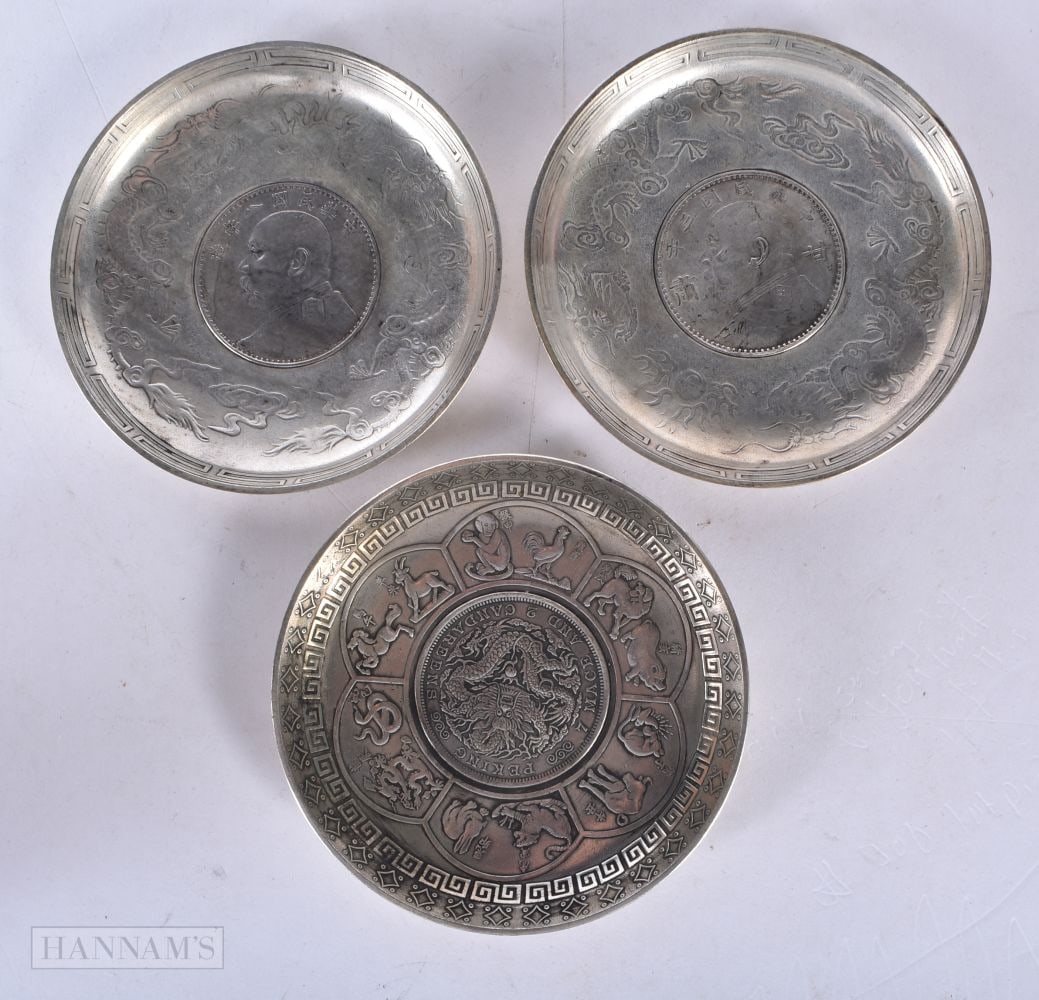 THREE CHINESE WHITE METAL COIN DISHES. 111 grams. 9.25 cm wide. (3) (1 of 3)
