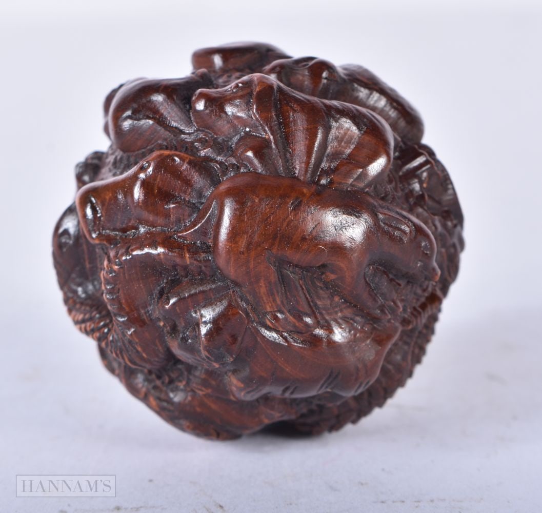 A CHINESE WOOD BALL. 4.75 cm wide.: A CHINESE WOOD BALL. 4.75 cm wide.