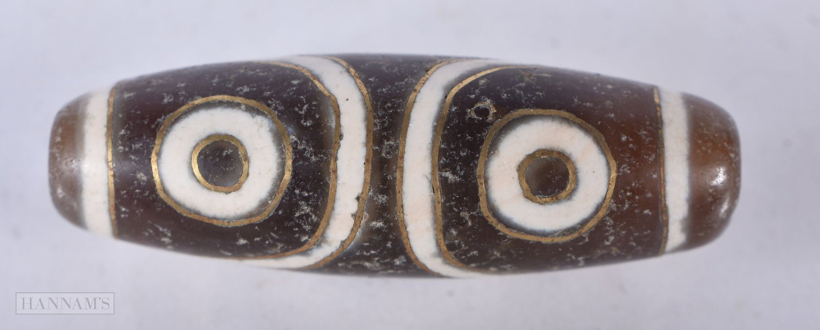 A TIBETAN AGATE BEAD. 4 cm wide. (1 of 3)