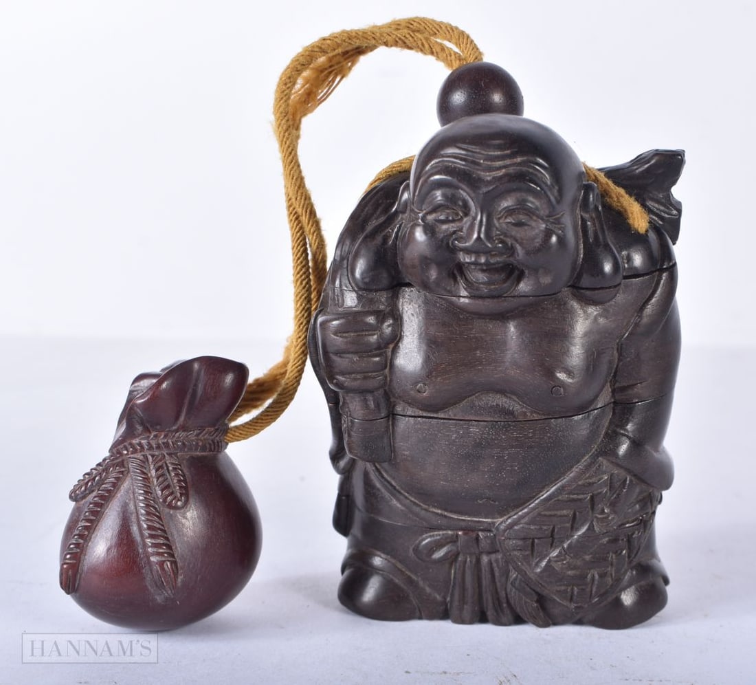 A JAPANESE WOOD BUDDHA INRO. 8.25 cm x 6 cm. (1 of 5)