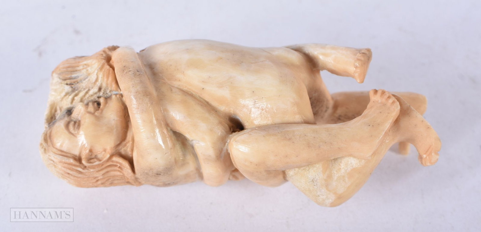 A JAPANESE EROTIC STAG ANTLER OKIMONO. 8 cm x 3 cm.: A JAPANESE EROTIC STAG ANTLER OKIMONO. 8 cm x 3 cm.