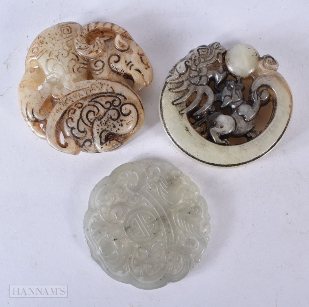 THREE CHINESE JADE ROUNDELS. 5.5 cm wide. (3) (1 of 2)