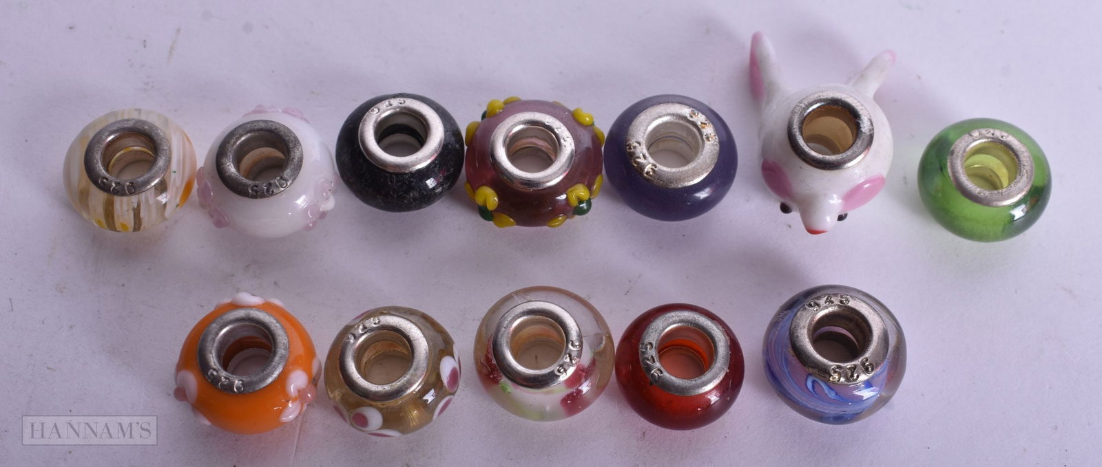 A COLLECTION OF SILVER CHARMS. 28 grams. 2.5 cm x 1.5 cm. (qty): A COLLECTION OF SILVER CHARMS. 28 grams. 2.5 cm x 1.5 cm. (qty)