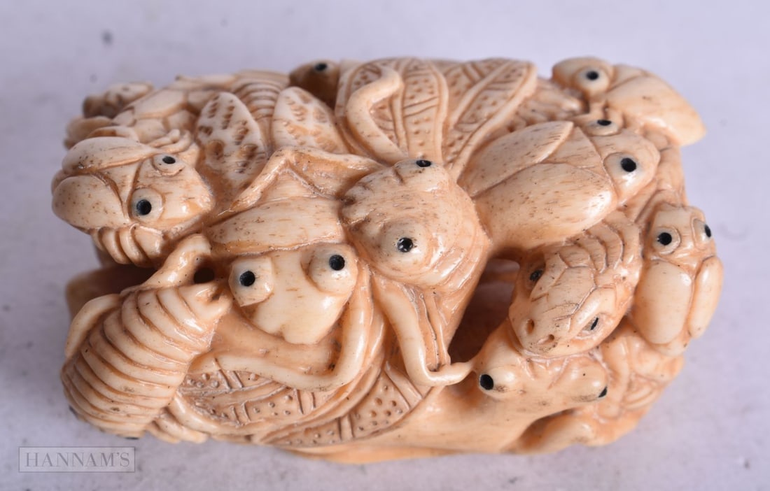 A JAPANESE BONE INSECT NETSUKE. 5 cm x 3 cm.: A JAPANESE BONE INSECT NETSUKE. 5 cm x 3 cm.