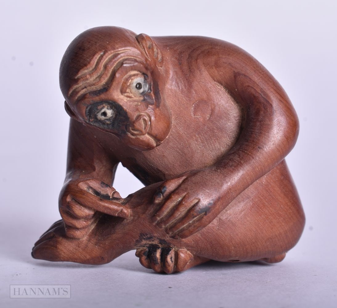 A JAPANESE WOOD MONKEY NETSUKE. 5.5 cm x 5 cm. (1 of 3)