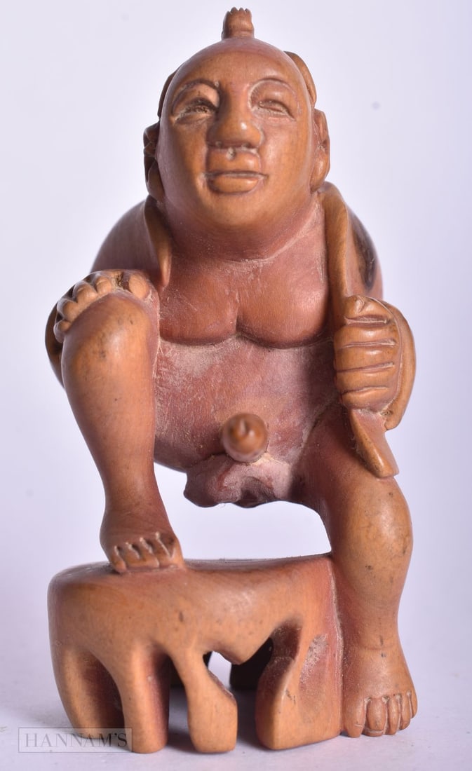 AN EROTIC WOOD OKIMONO. 6.5 cm x 4 cm. (1 of 4)