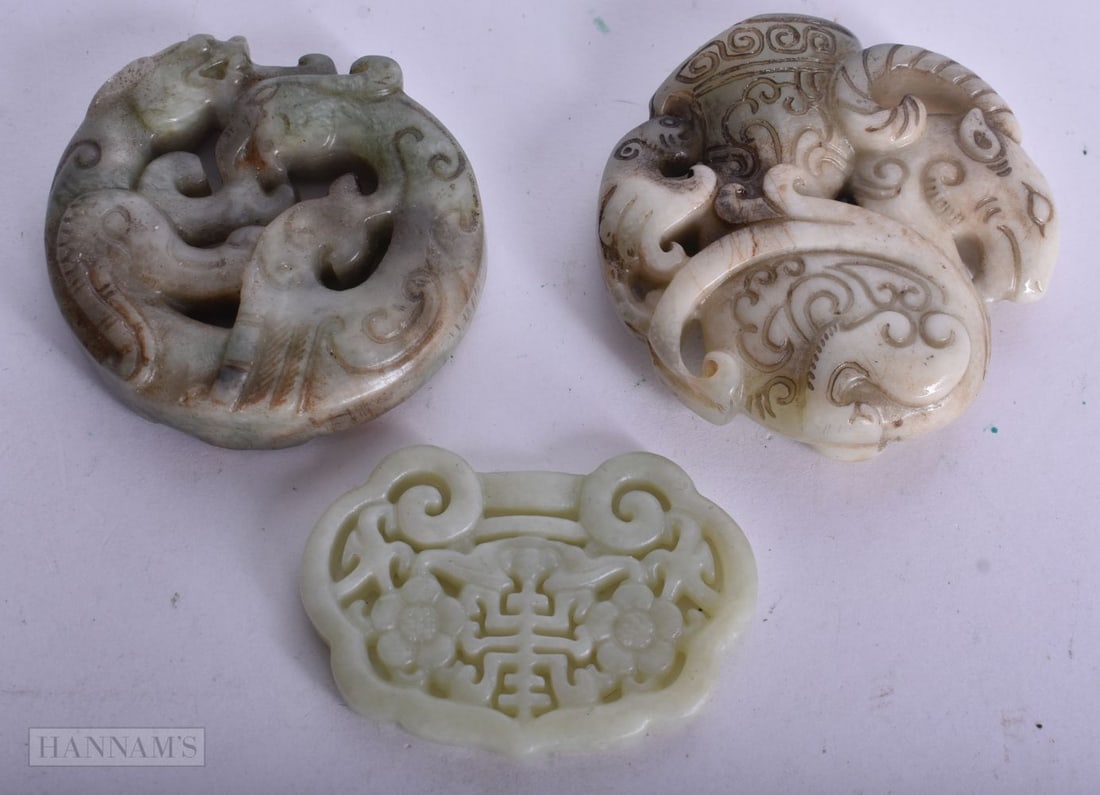 THREE CHINESE JADES. 5.5 cm wide. (3) (1 of 2)