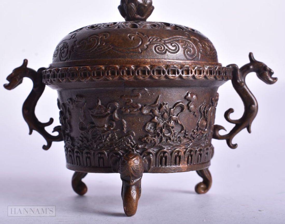 A CHINESE BRONZE CENSER. 10 cm x 7.5 cm.: A CHINESE BRONZE CENSER. 10 cm x 7.5 cm.