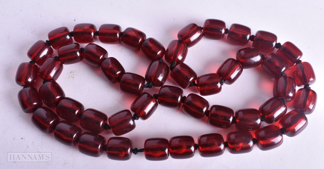 A RED BEAD NECKLACE. Untested. 57 grams. 70 cm long.: A RED BEAD NECKLACE. Untested. 57 grams. 70 cm long.