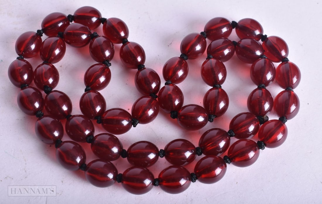 A CHERY BEAD NECKLACE. Untested. 42.2 grams. 70 cm long. (1 of 3)