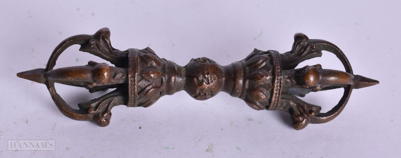 A TIBETAN BRONZE PHURBA. 10.5 cm high.: A TIBETAN BRONZE PHURBA. 10.5 cm high.